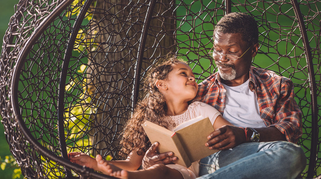 Girl reading a book with Grandpa